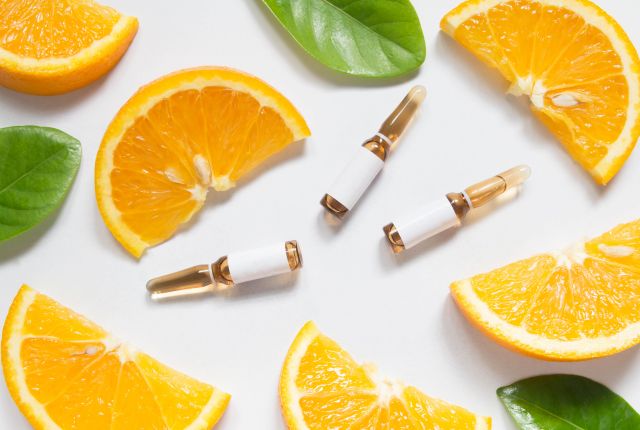 化粧品、オレンジ、植物の葉の画像